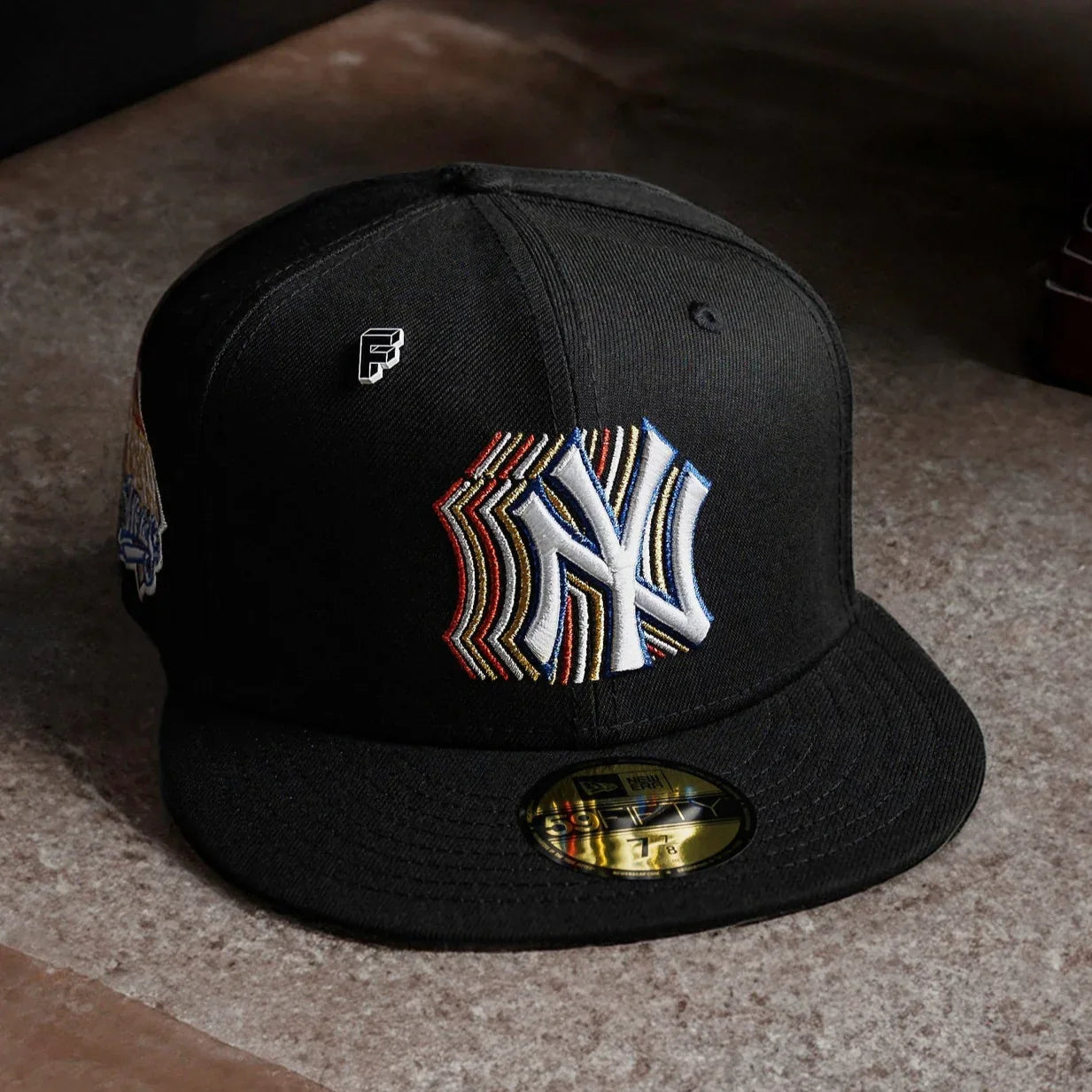 Black baseball cap with a logo on a textured surface NY Yankees
