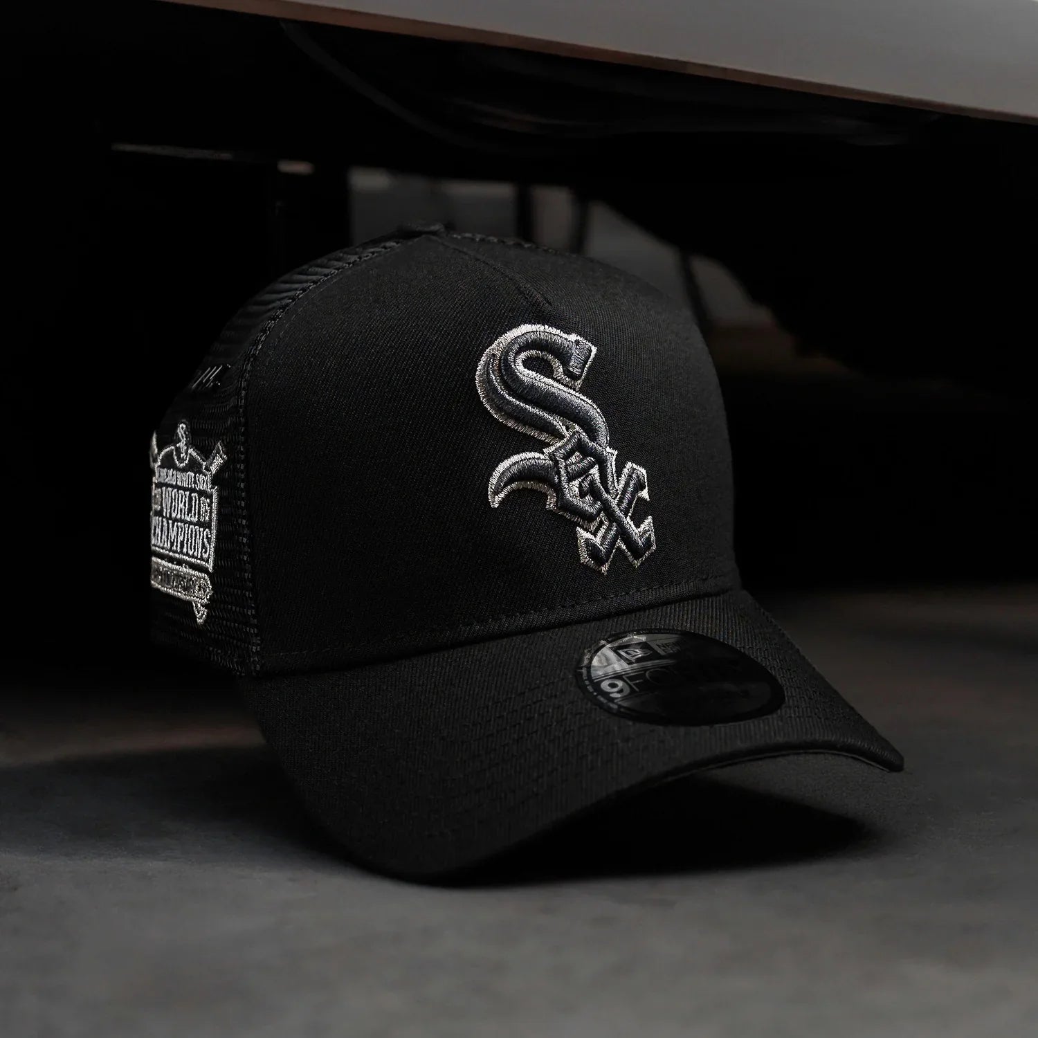 Black cap with a logo on a dark background