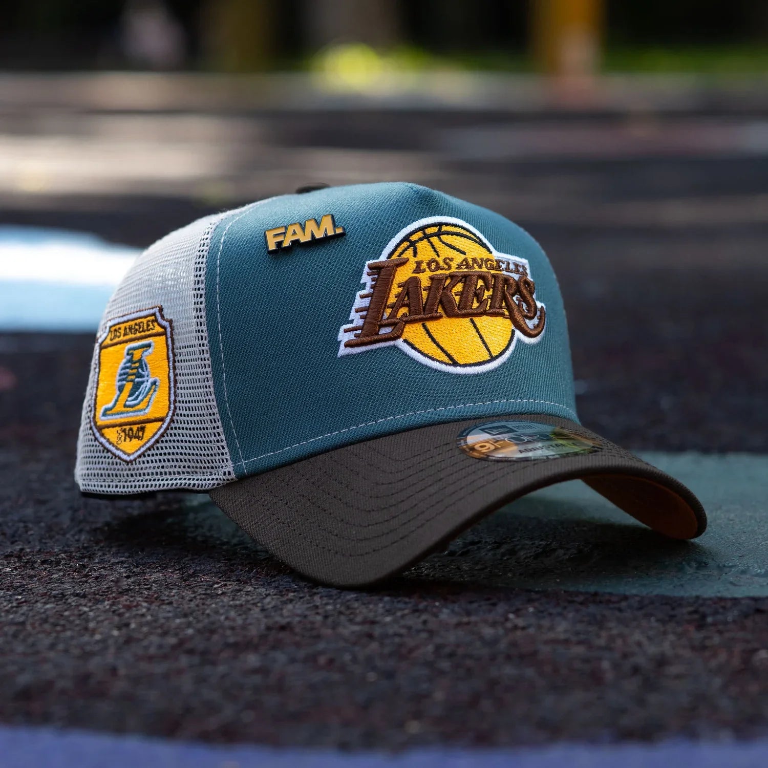 Los Angeles Lakers cap with brand logos on a blurred background