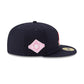 NEW ERA 59FIFTY MLB CLEVELAND GUARDIANS SIDE PATCH BLOOM NAVY / PINK UV FITTED CAP